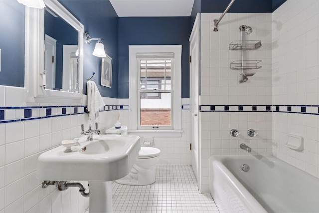 1295 Fairmount Ave, Saint Paul, MN 55105 - full bath featuring bathtub / shower combination, a wainscoted wall, tile patterned flooring, and tile walls