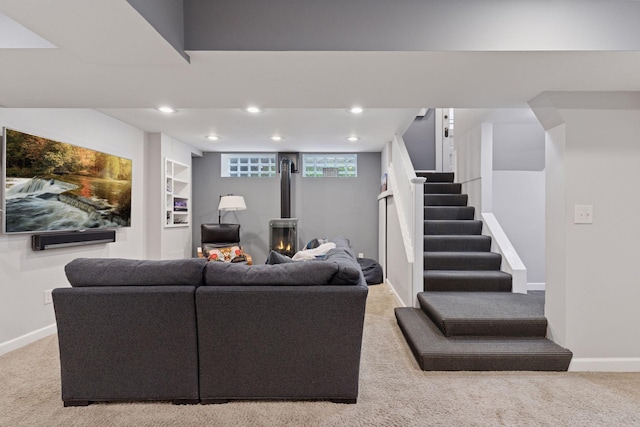 1295 Fairmount Ave, Saint Paul, MN 55105 - living area with carpet floors, a wood stove, recessed lighting, and stairway