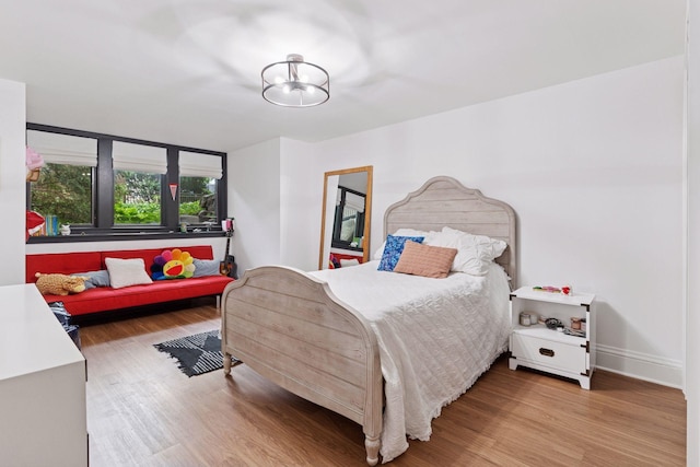 1295 Fairmount Ave, Saint Paul, MN 55105 - bedroom featuring wood finished floors and a chandelier