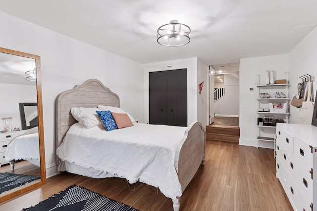1295 Fairmount Ave, Saint Paul, MN 55105 - bedroom featuring wood finished floors and a closet