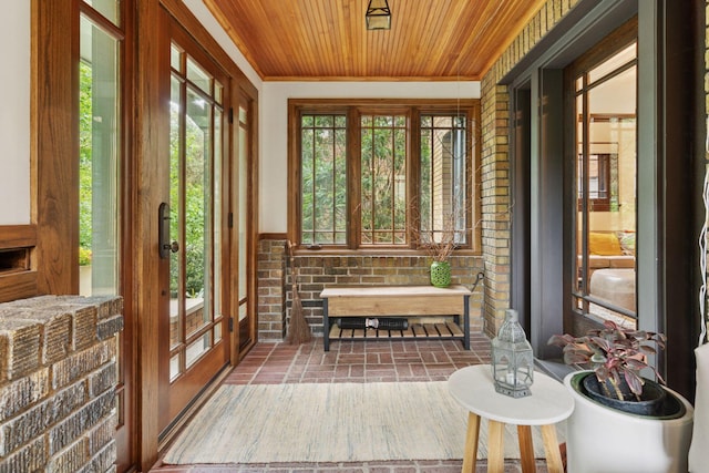 1295 Fairmount Ave, Saint Paul, MN 55105 - sunroom with wood ceiling, plenty of natural light, brick floors, ornamental molding, and brick wall