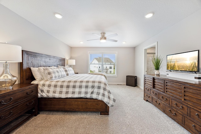 bedroom with light colored carpet, recessed lighting, baseboards, and ceiling fan