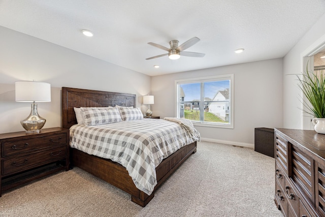 bedroom featuring baseboards, a ceiling fan, recessed lighting, and light carpet