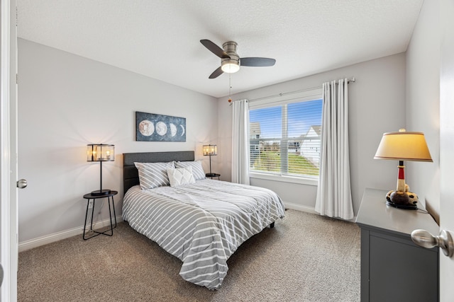 bedroom featuring baseboards, a ceiling fan, and carpet flooring