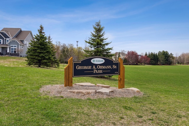 community sign with a lawn