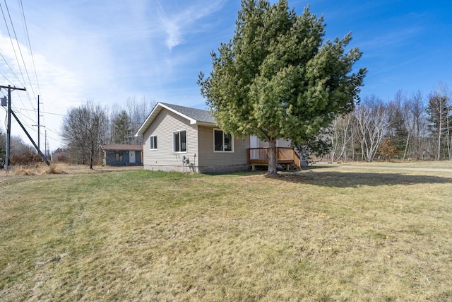 exterior space featuring a yard and a deck