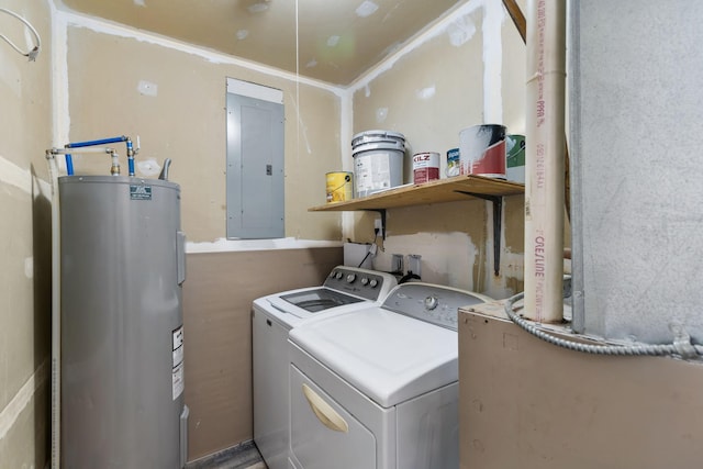 clothes washing area with washing machine and dryer, electric panel, electric water heater, and laundry area