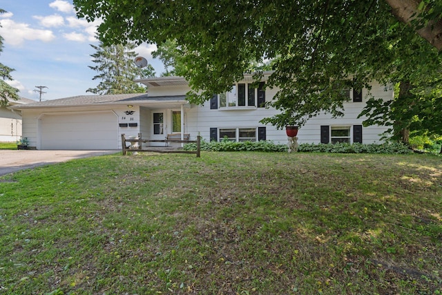 84 Logan Ave W, West Saint Paul, MN 55118 - tri-level home featuring an attached garage, concrete driveway, and a front lawn