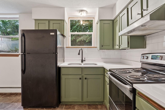 84 Logan Ave W, West Saint Paul, MN 55118 - kitchen with green cabinetry, stainless steel electric stove, freestanding refrigerator, under cabinet range hood, and light countertops