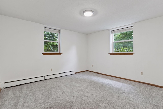 84 Logan Ave W, West Saint Paul, MN 55118 - unfurnished room with a baseboard heating unit and carpet