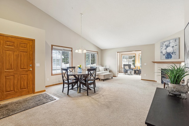 3621 Lansing Ave NE, Saint Michael, MN 55376 - dining area featuring light colored carpet, plenty of natural light, a chandelier, and high vaulted ceiling