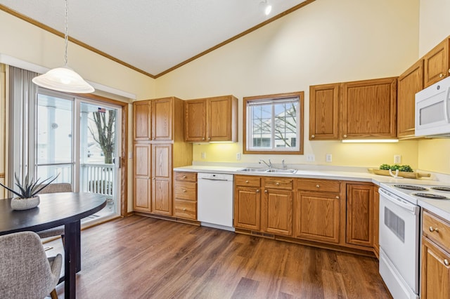 3621 Lansing Ave NE, Saint Michael, MN 55376 - kitchen with white appliances, ornamental molding, brown cabinetry, light countertops, and high vaulted ceiling