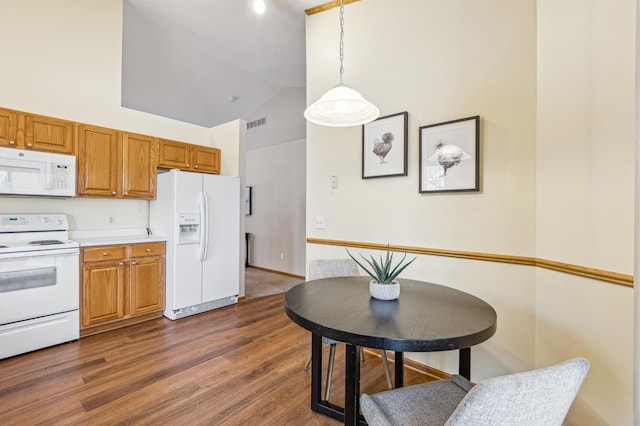3621 Lansing Ave NE, Saint Michael, MN 55376 - kitchen featuring white appliances, brown cabinets, high vaulted ceiling, light countertops, and pendant lighting