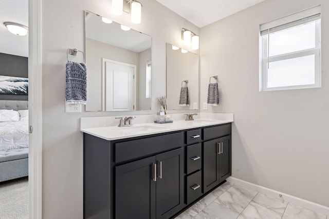 full bathroom with marble finish floor, ensuite bath, a sink, and double vanity