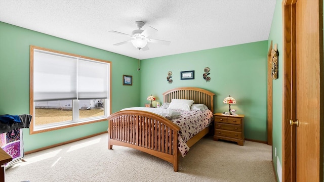112 Sandpiper Cir, Hastings, MN 55033 - carpeted bedroom with a textured ceiling, baseboards, and a ceiling fan