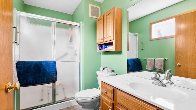 112 Sandpiper Cir, Hastings, MN 55033 - bathroom featuring a shower stall, toilet, and vanity