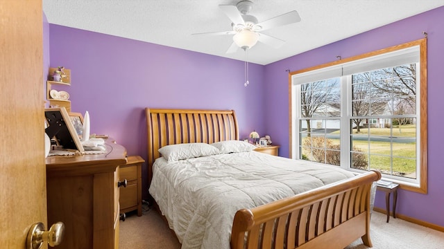 112 Sandpiper Cir, Hastings, MN 55033 - bedroom featuring carpet floors, multiple windows, baseboards, and a ceiling fan
