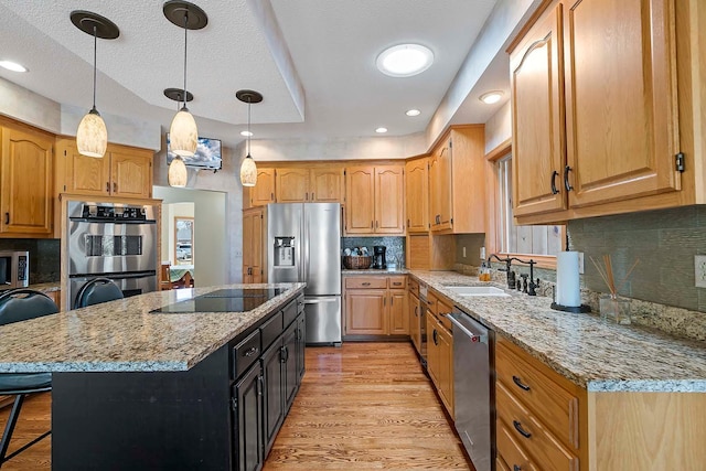 3931 Crestview Dr, Chanhassen, MN 55331 - kitchen with appliances with stainless steel finishes, a breakfast bar area, light stone counters, tasteful backsplash, and pendant lighting