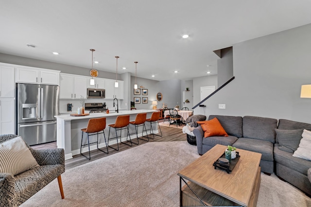 22962 Hazel Ln, Rogers, MN 55374 - living area with light wood-style flooring and recessed lighting
