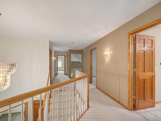 1844 Red Fox Rd, Eagan, MN 55122 - hallway featuring an upstairs landing, light colored carpet, and a chandelier