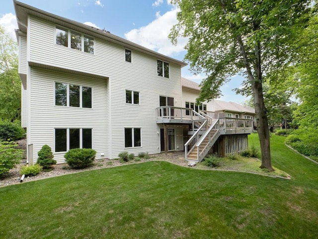 1844 Red Fox Rd, Eagan, MN 55122 - rear view of house featuring a deck, a lawn, and stairway