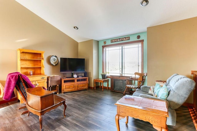 living area featuring dark wood-style floors, vaulted ceiling, and baseboards