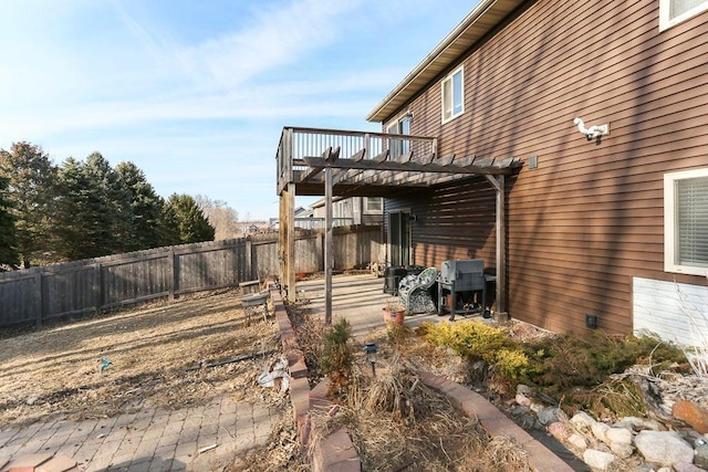 view of yard featuring a fenced backyard and a deck