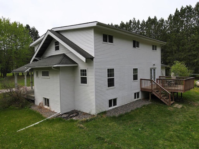 21327 Keyview Rd, Grand Rapids, MN 55744 - rear view of house featuring a wooden deck and a yard