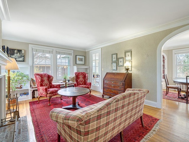 25 Benhill Rd, Saint Paul, MN 55105 - living room with arched walkways, wood finished floors, crown molding, and a textured wall