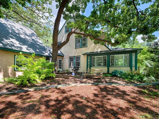 25 Benhill Rd, Saint Paul, MN 55105 - back of house with stucco siding and a patio area
