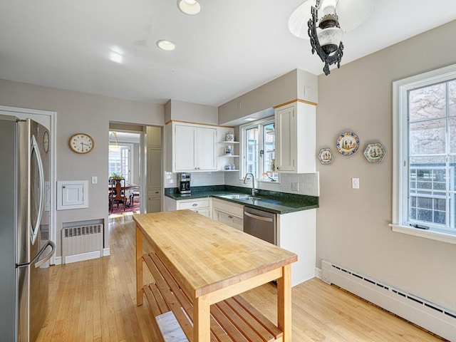25 Benhill Rd, Saint Paul, MN 55105 - kitchen with appliances with stainless steel finishes, a baseboard radiator, radiator, open shelves, and light wood-style flooring