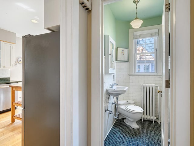25 Benhill Rd, Saint Paul, MN 55105 - bathroom featuring radiator, tile patterned flooring, and tile walls