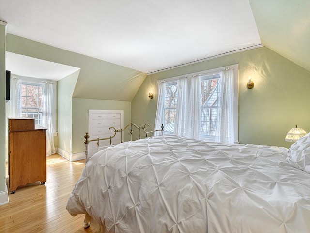 25 Benhill Rd, Saint Paul, MN 55105 - bedroom with lofted ceiling and light wood-type flooring
