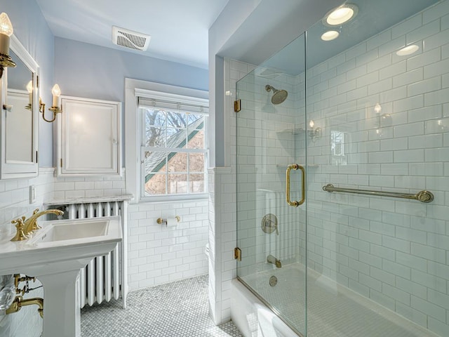 25 Benhill Rd, Saint Paul, MN 55105 - full bath with bath / shower combo with glass door, tile patterned floors, and tile walls