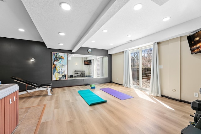 436 Bruns Ct, Vadnais Heights, MN 55127 - workout area featuring wood finished floors, recessed lighting, a textured ceiling, and baseboards