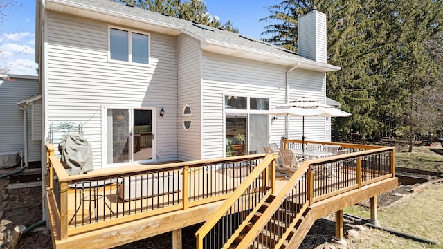 436 Bruns Ct, Vadnais Heights, MN 55127 - rear view of property featuring a wooden deck, a chimney, a shingled roof, and central air condition unit