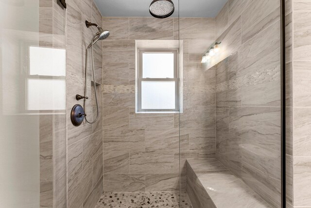 bathroom with tiled shower
