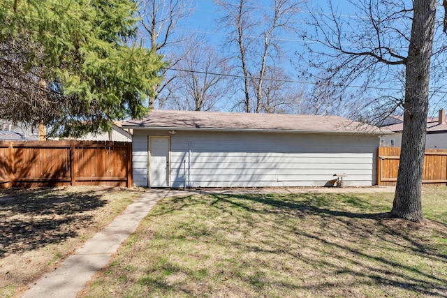 view of outbuilding with fence