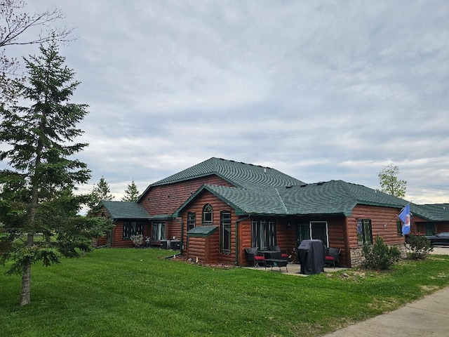 20371 Golf Crest Dr, Grand Rapids, MN 55744 - back of property with log veneer siding and a lawn