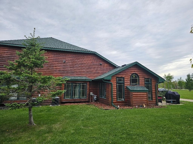 20371 Golf Crest Dr, Grand Rapids, MN 55744 - rear view of property with a lawn, log veneer siding, and central air condition unit