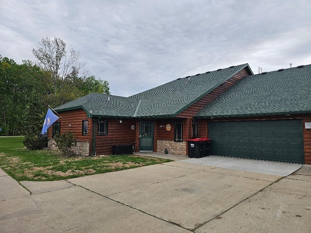 20371 Golf Crest Dr, Grand Rapids, MN 55744 - view of front facade with an attached garage, concrete driveway, log veneer siding, and stone siding