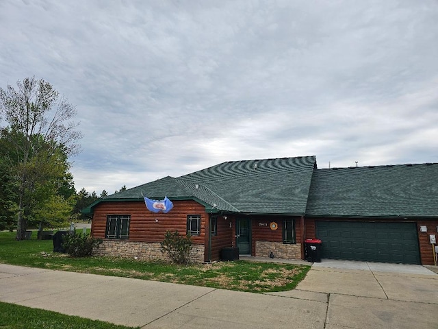 20371 Golf Crest Dr, Grand Rapids, MN 55744 - view of front of property featuring an attached garage, driveway, stone siding, and faux log siding