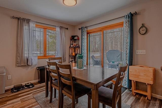 20371 Golf Crest Dr, Grand Rapids, MN 55744 - dining space featuring wood finished floors and baseboards
