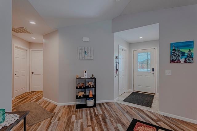 20371 Golf Crest Dr, Grand Rapids, MN 55744 - entrance foyer featuring wood finished floors, baseboards, lofted ceiling, and recessed lighting