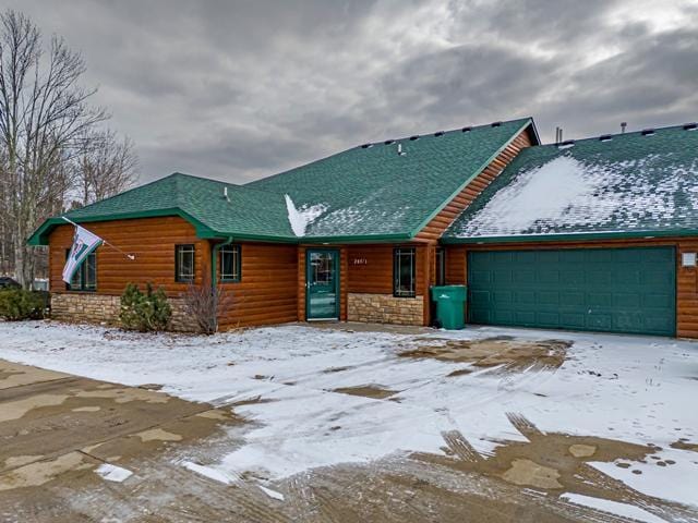 20371 Golf Crest Dr, Grand Rapids, MN 55744 - rustic home with faux log siding, a garage, and stone siding