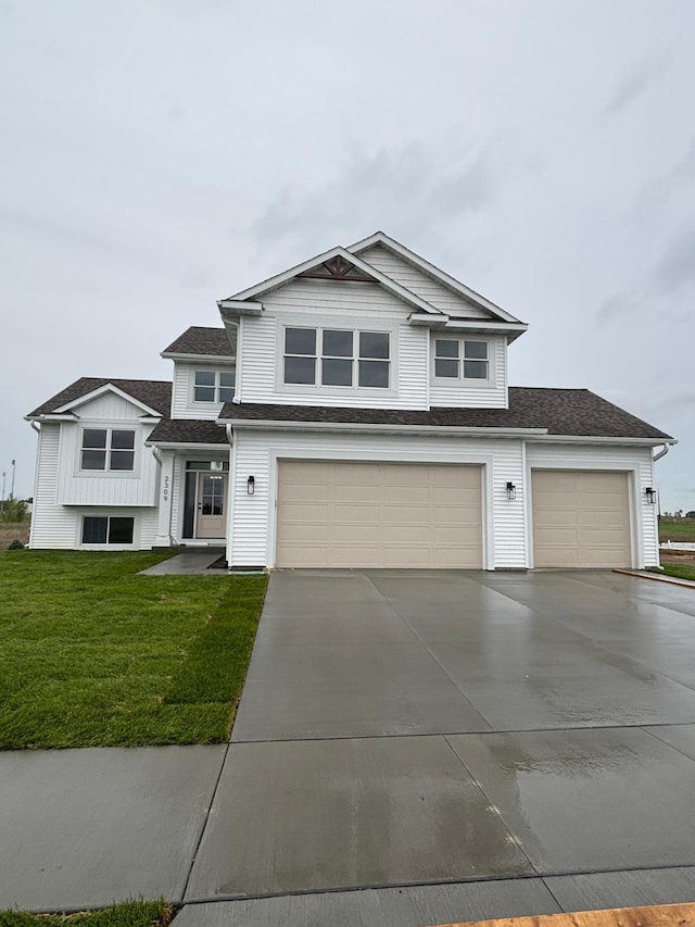 2309 Elk Run Dr SE, Pine Island, MN 55963 - view of front of home with driveway, a front lawn, a garage, and roof with shingles