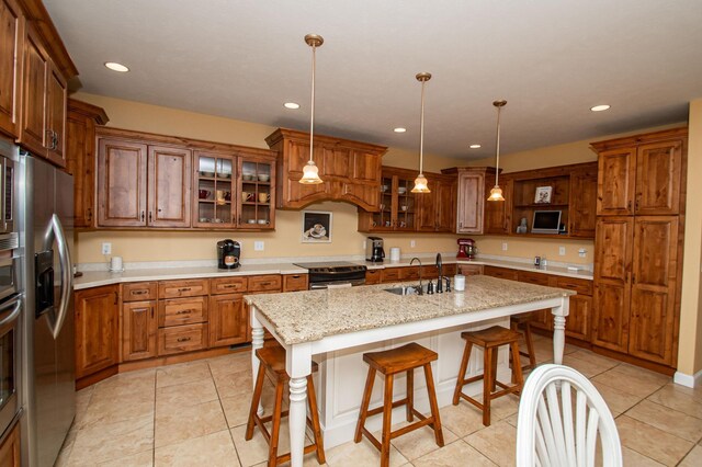 241 Cottonwood Cv, Lynd, MN 56157 - kitchen featuring a sink, appliances with stainless steel finishes, and brown cabinets