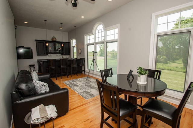 241 Cottonwood Cv, Lynd, MN 56157 - dining space featuring recessed lighting, light wood-style flooring, indoor wet bar, and ceiling fan