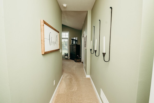 241 Cottonwood Cv, Lynd, MN 56157 - corridor featuring light carpet, baseboards, and vaulted ceiling