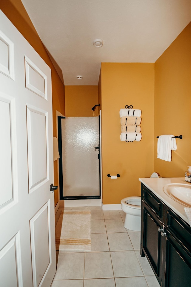241 Cottonwood Cv, Lynd, MN 56157 - bathroom with a shower, baseboards, toilet, tile patterned floors, and vanity